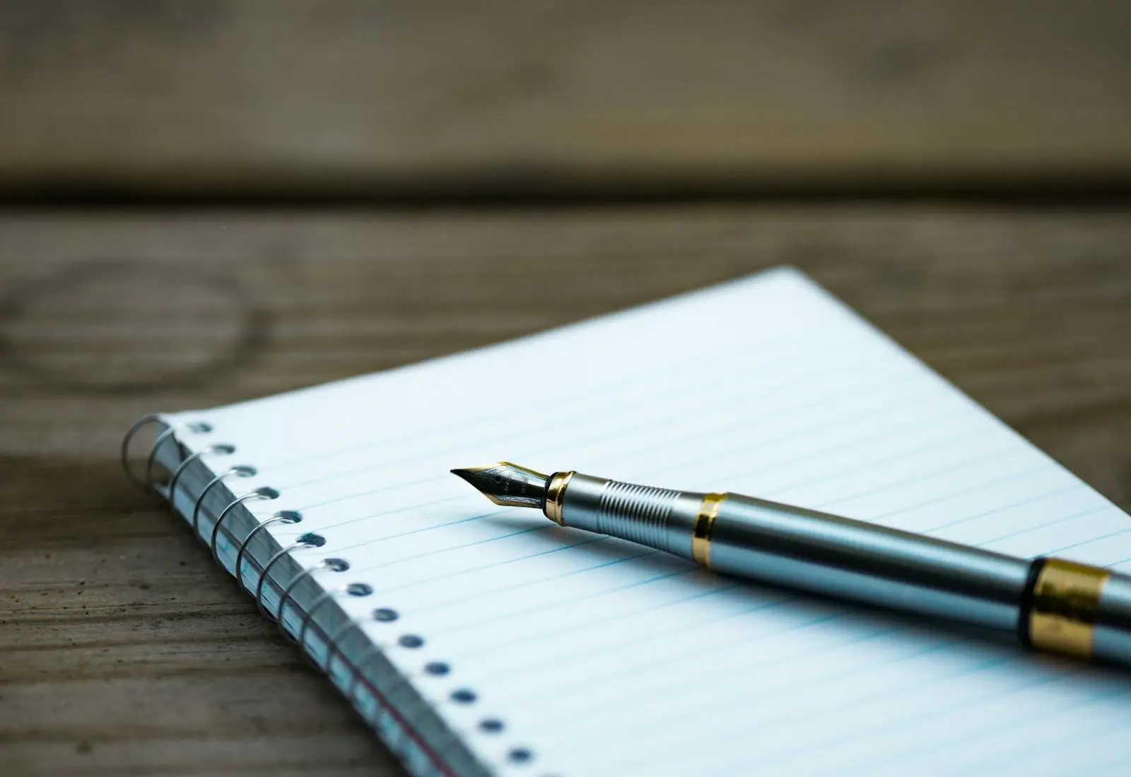 A notebook and a fountain pen