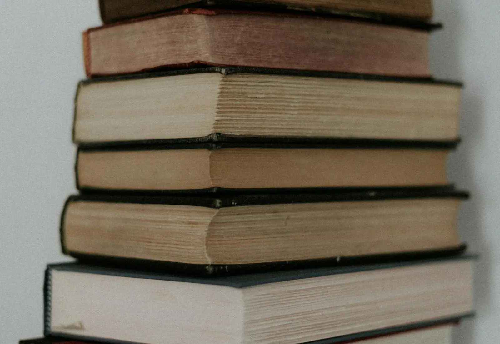 A tall stack of old books